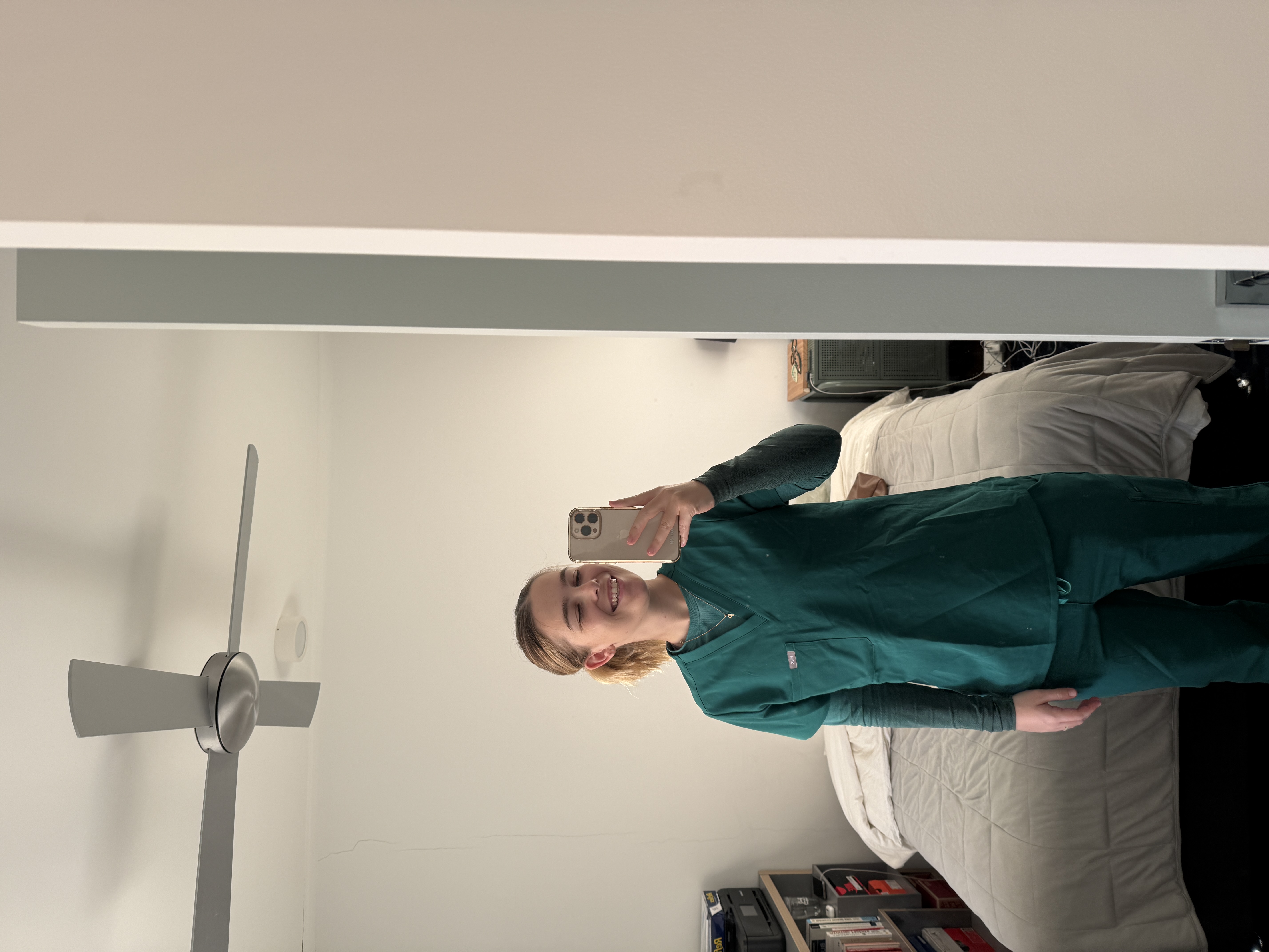 Phoebe in green scrubs
